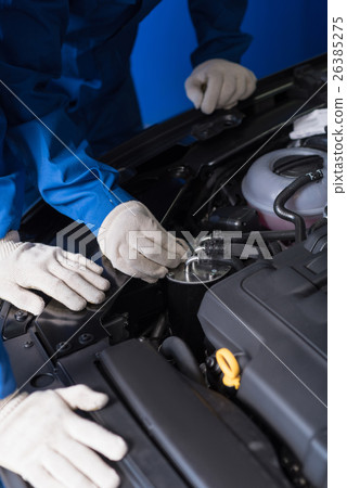 Professional mechanics working on car break out Professional mechanics working on car break out 26385275