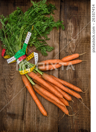 Carrots with measurement tape. Diet healthy eating 26387454