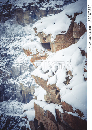 Rocks large granite  covered with snow 26387831