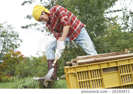 Men working in a country living saw 26389851