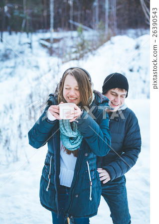 Loving couple having fun outdoors in winter Loving couple having fun outdoors in winter 26390543