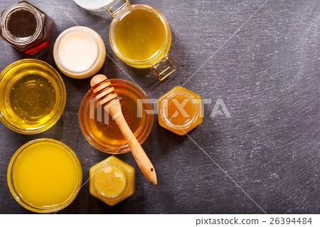 various types of honey in glass jars various types of honey in glass jars 26394484