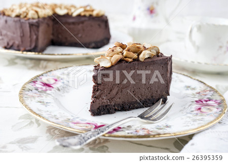 Chocolate Pie with Nuts on Plate 26395359