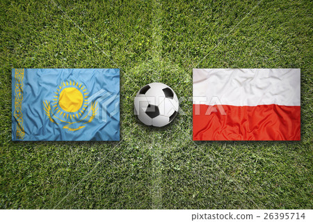 Kazakhstan vs. Poland flags on soccer field Kazakhstan vs. Poland flags on soccer field 26395714
