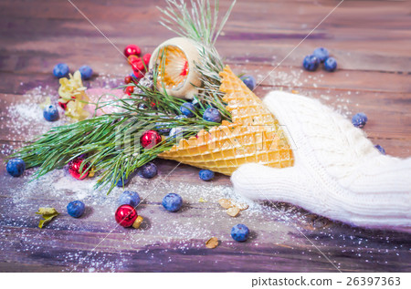 Christmas balls, waffle cone in hands with knit Christmas balls, waffle cone in hands with knit 26397363