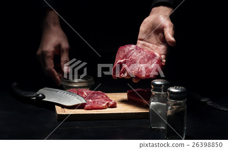 Close up of mans hands holding chopped meat 26398850