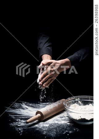 Close up of young mans hands preparing flour for Close up of young mans hands preparing flour for 26398988
