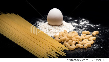Close up of pasta spaghetti and eggs lying on Close up of pasta spaghetti and eggs lying on 26399162