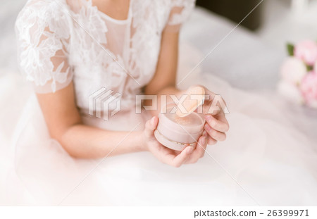 Young bride doing her face at home Young bride doing her face at home 26399971