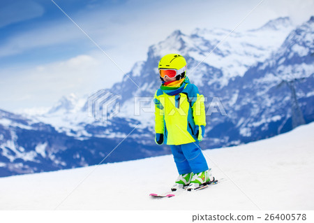 Ski and snow fun. Child in winter mountains. 26400578