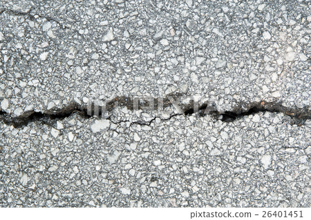 closeup on concrete asphalt cracks on the road. 26401451