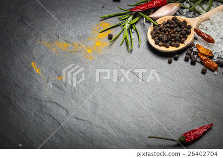 spices and herbs over black stone background 26402704