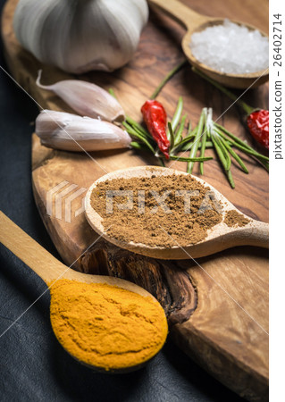 Spices on rustic wooden table 26402714