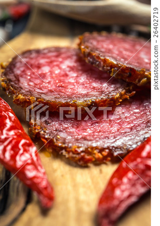dried salami crusted in ground red pepper dried salami crusted in ground red pepper 26402719