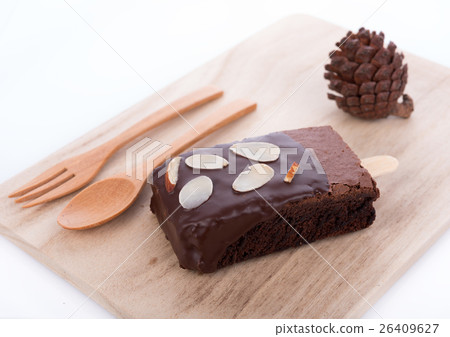 Brownie almonds on wood plate Brownie almonds on wood plate 26409627