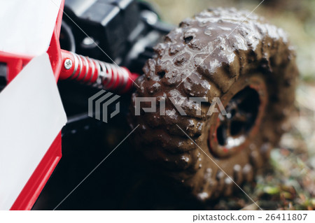 Muddy wheels of toy car close-up Muddy wheels of toy car close-up 26411807