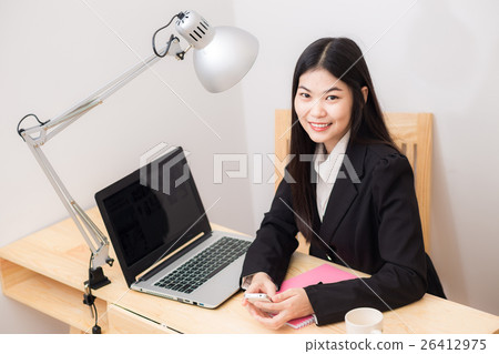 Asian business woman with working desk in office Asian business woman with working desk in office 26412975
