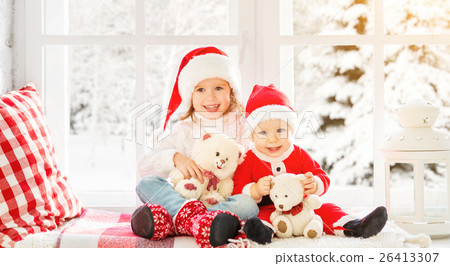 happy family children brother and sister  on winter window Chris 26413307