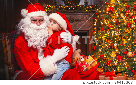 happy child girl hugging Santa happy child girl hugging Santa 26413308
