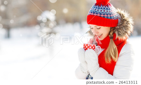 happy young woman with a cup of hot tea in winter walk happy young woman with a cup of hot tea in winter walk 26413311