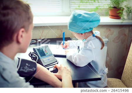 Young female doctor or nurse taking patients Young female doctor or nurse taking patients 26415496
