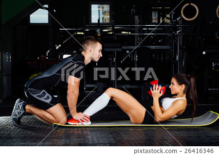 Woman doing abdominal crunches press exercise on 26416346