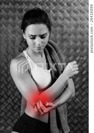 Beautiful young fitness woman feeling pain. 26416899