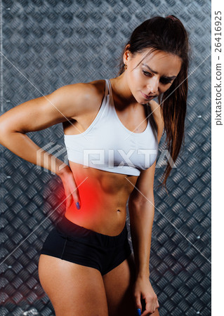 Beautiful young fitness woman feeling pain. 26416925