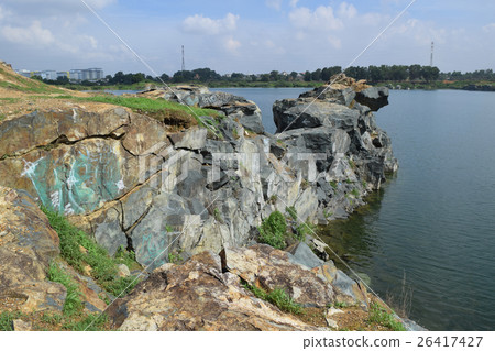 rocky lake with stone and cliff rocky lake with stone and cliff 26417427