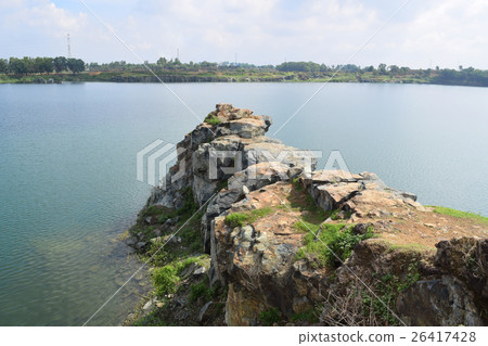 rocky lake with stone and cliff rocky lake with stone and cliff 26417428