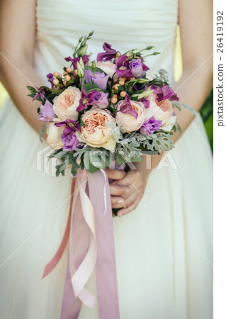 Bride holding wedding bouquet Bride holding wedding bouquet 26419192