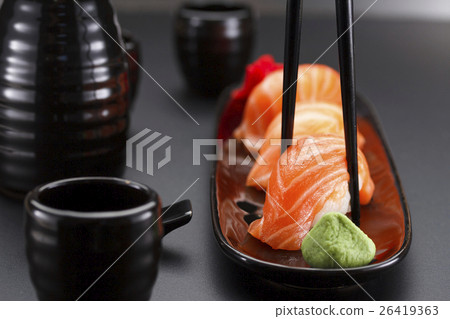 Japanese cuisine. Sushi roll with soy sauce Japanese cuisine. Sushi roll with soy sauce 26419363