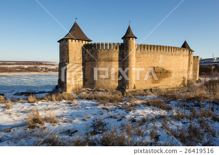 Ancient stone castle in winter. Landscape 26419516