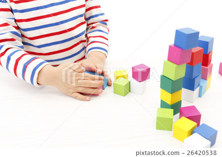 Boy playing with building blocks Boy playing with building blocks 26420538