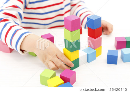 Boy playing with building blocks Boy playing with building blocks 26420540