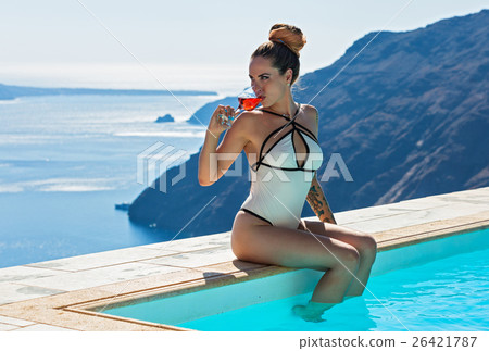 Woman in swimsuit sunbathing 26421787