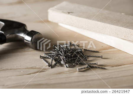 iron hammer, nail, lumber 26421947