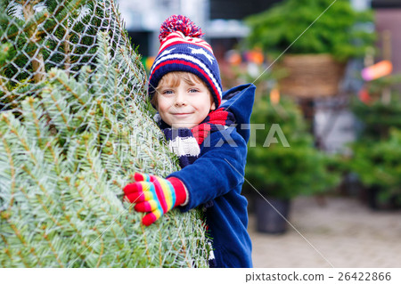 beautiful smiling little boy holding christmas beautiful smiling little boy holding christmas 26422866