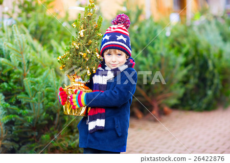 beautiful smiling little boy holding christmas beautiful smiling little boy holding christmas 26422876