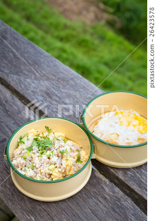 fried rice in food carrier at balcony in field 26423578