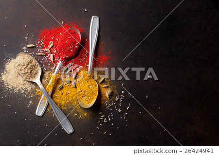 Various spices spoons on stone table Various spices spoons on stone table 26424941