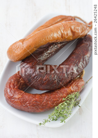 smoked sausages on plate 26425248
