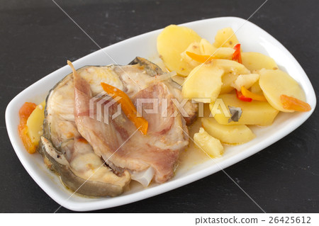 fish with vegetables in white dish 26425612