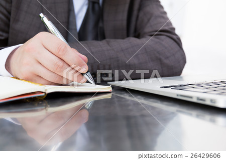 Businessmen taking notes 26429606