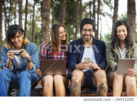 Friends Using Digital Device Outdoors Concept 26433289
