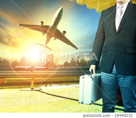 business man and breifcase standing in airport terminal building 26440232