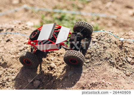 Toy crawler riding off road rally, copy space 26440909