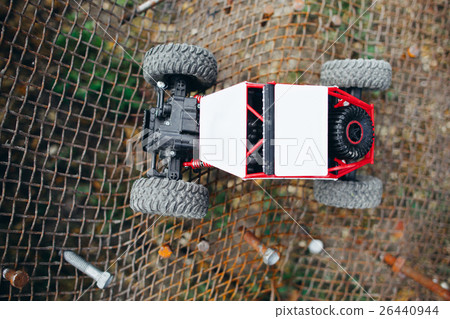 Rc truck on metal lettice, top view 26440944