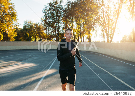 Runner practicing run on athletics running track 26440952