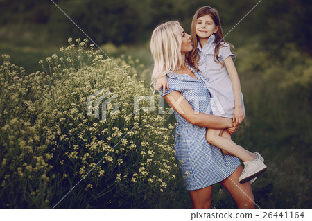mom and daughter outside 26441164